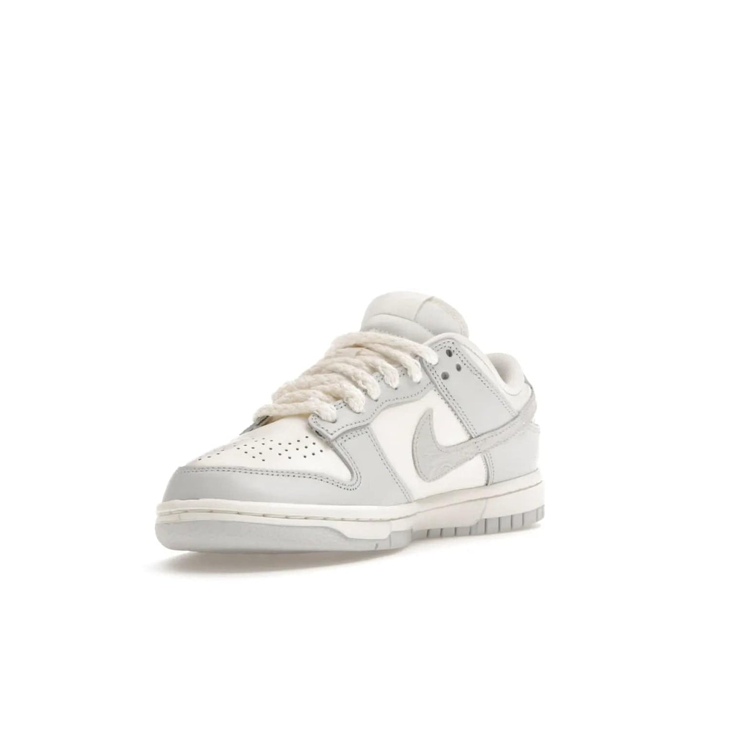 Nike Dunk Low Needlework Sail Aura (Women's) - Image 14 - Only at www.BallersClubKickz.com - Discover the Nike Dunk Low Needlework Sail Aura for Women. Boasting a beautiful Sail and Neutral Grey upper, this stylish sneaker offers durable materials with ultra-soft cushioning for all-day comfort. Get your pair today!