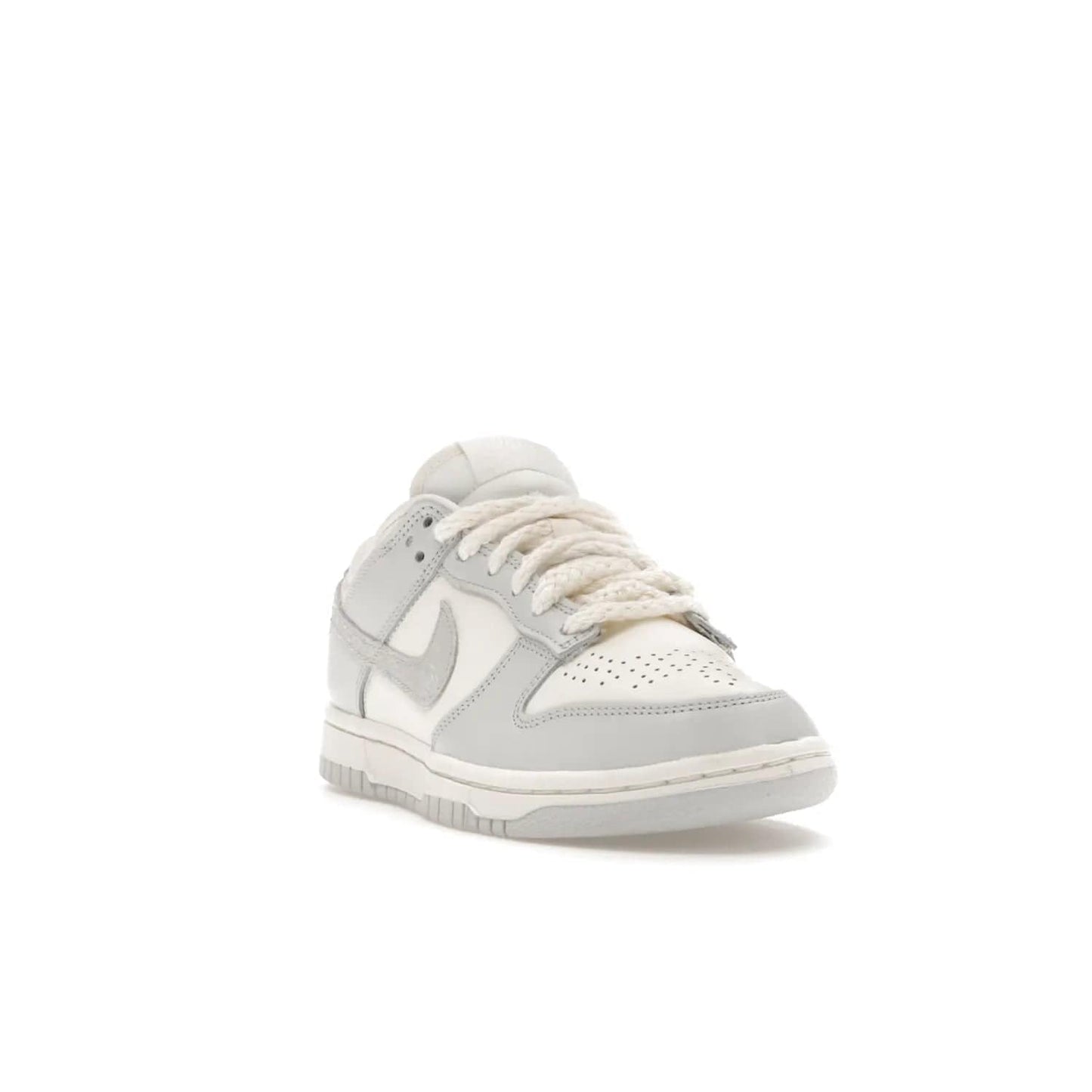 Nike Dunk Low Needlework Sail Aura (Women's) - Image 7 - Only at www.BallersClubKickz.com - Discover the Nike Dunk Low Needlework Sail Aura for Women. Boasting a beautiful Sail and Neutral Grey upper, this stylish sneaker offers durable materials with ultra-soft cushioning for all-day comfort. Get your pair today!