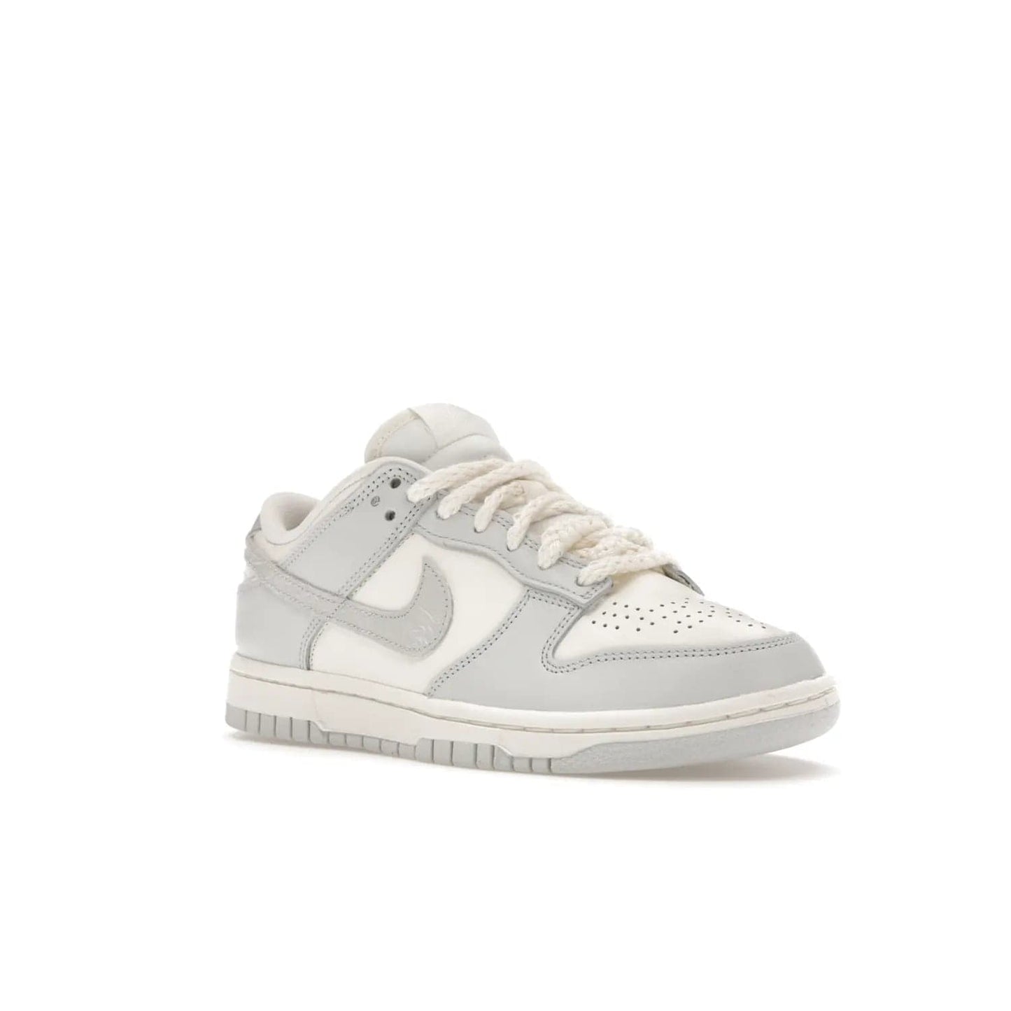 Nike Dunk Low Needlework Sail Aura (Women's) - Image 5 - Only at www.BallersClubKickz.com - Discover the Nike Dunk Low Needlework Sail Aura for Women. Boasting a beautiful Sail and Neutral Grey upper, this stylish sneaker offers durable materials with ultra-soft cushioning for all-day comfort. Get your pair today!