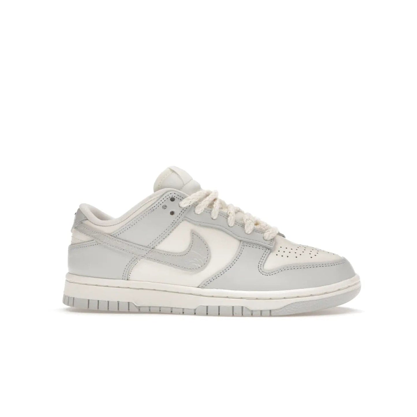 Nike Dunk Low Needlework Sail Aura (Women's) - Image 2 - Only at www.BallersClubKickz.com - Discover the Nike Dunk Low Needlework Sail Aura for Women. Boasting a beautiful Sail and Neutral Grey upper, this stylish sneaker offers durable materials with ultra-soft cushioning for all-day comfort. Get your pair today!
