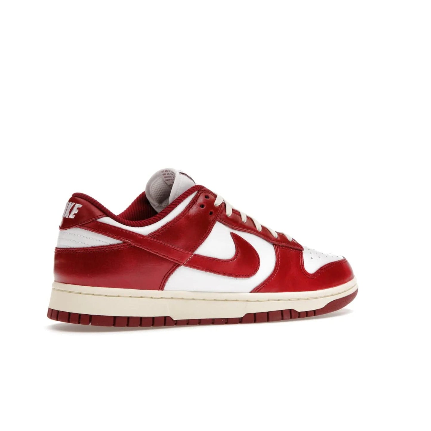 Nike Dunk Low PRM Vintage Team Red (Women's) - Image 34 - Only at www.BallersClubKickz.com - Shop the stylish Nike Dunk Low PRM Vintage Team Red. Signature Red and White leather with Coconut Milk midsoles for an aged finish. 21 April 2023 release.